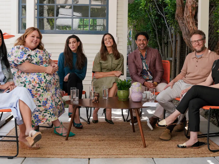 Ai-jen Poo, Chrissy Metz, producer KJ Steinberg, Mandy Moore, Jon Huertas, and Seth and Lauren Miller Rogen smile and pose for the camera, behind the scenes of This is Us: This is care. A conversation.
