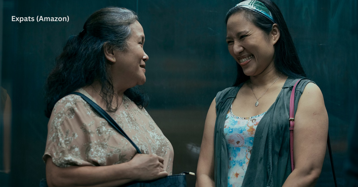 Two domestic workers smiling, expressing gratitude and solidarity.