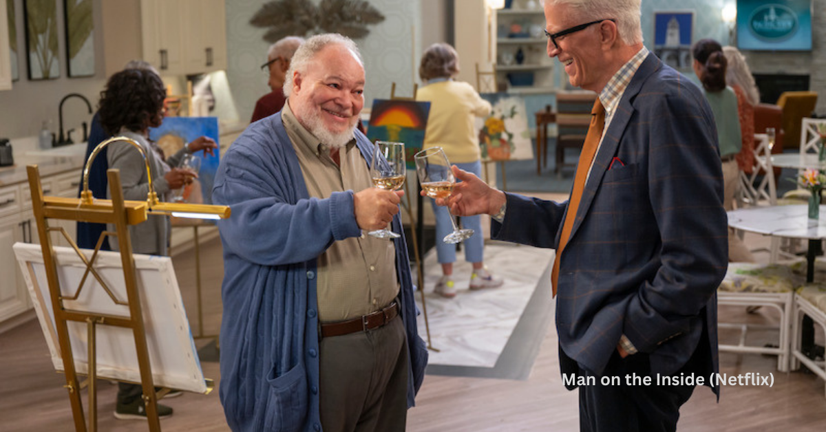 Two aging men cheering each other with glasses of wine.