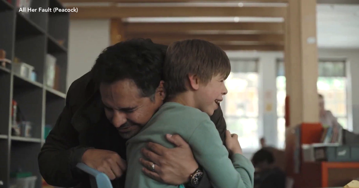 A father and son embracing each other.